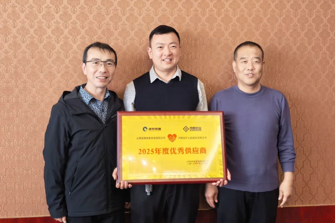 Customer and supplier representatives holding a supplier-recognition plaque Customer and supplier representatives holding a supplier-recognition plaque