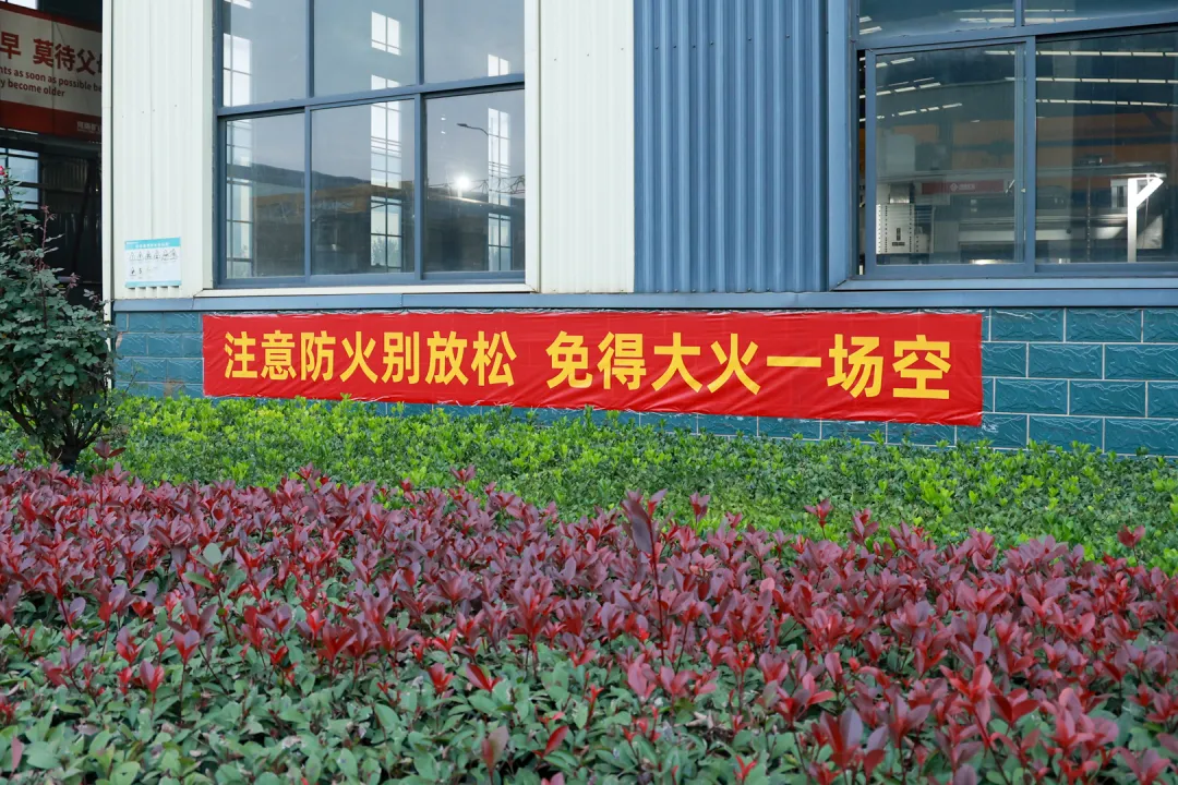 Fire-prevention banner outside a workshop window