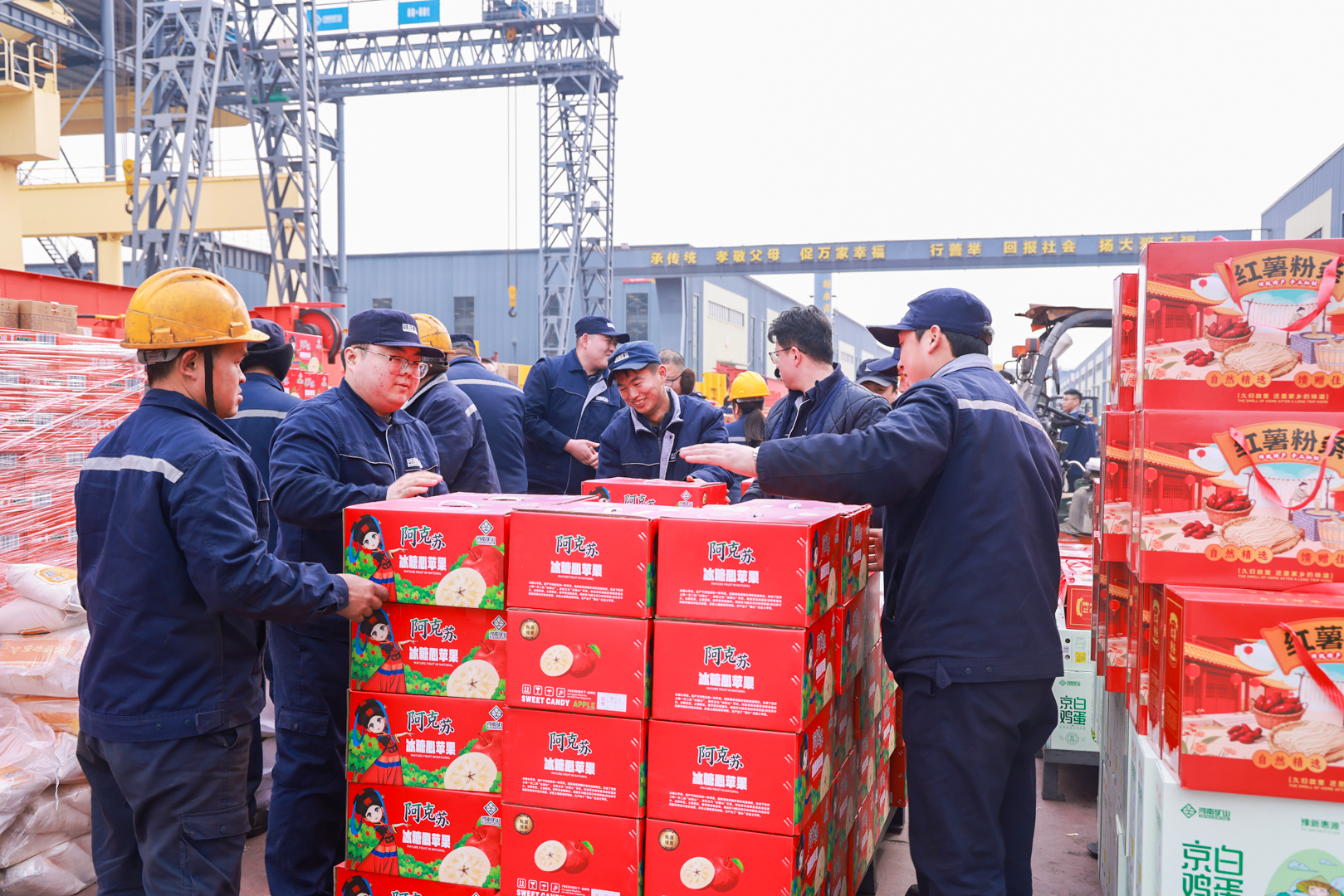 Employees helping to distribute boxed gifts at Henan Mine Crane before the Lunar New Year