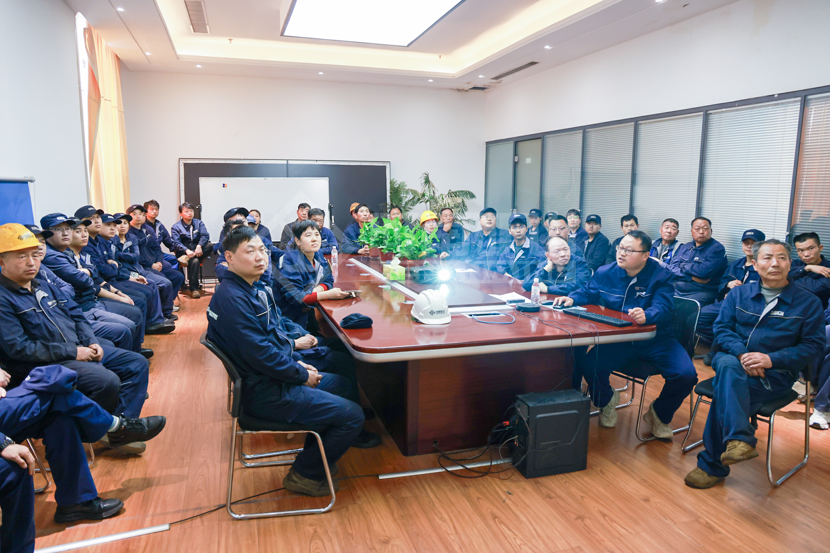 Workshop team discussing manufacturing process requirements