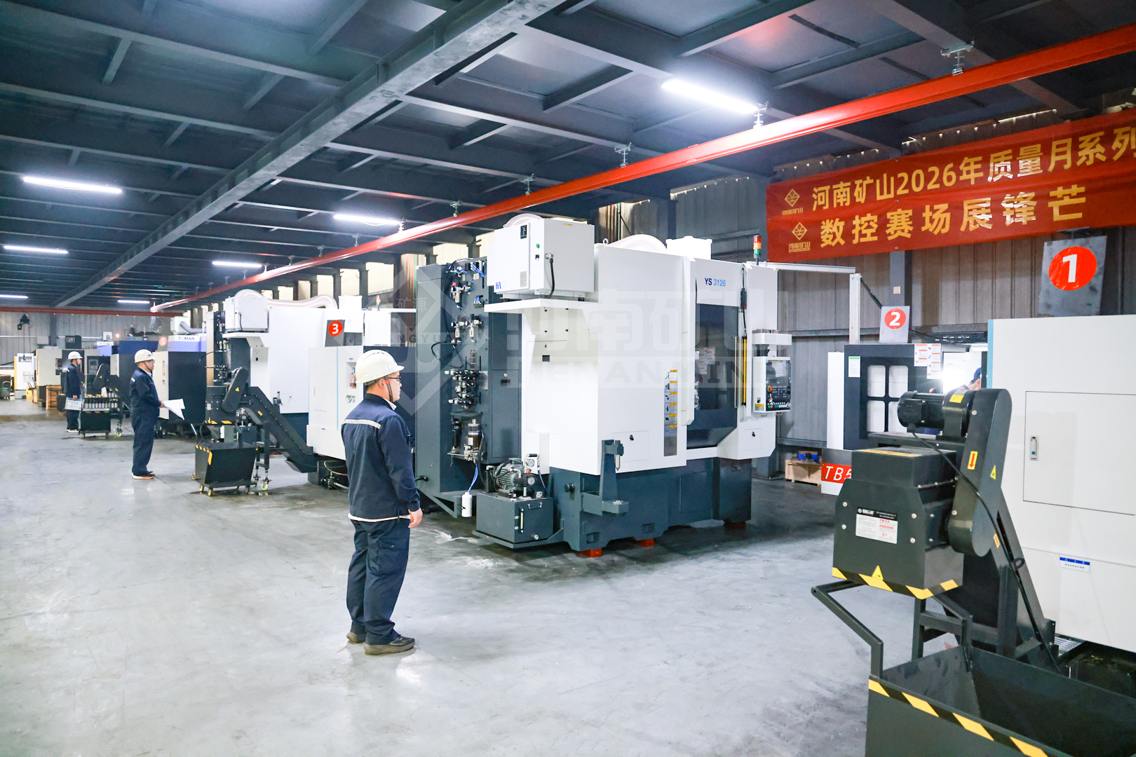 CNC machines and competitors in the manufacturing workshop