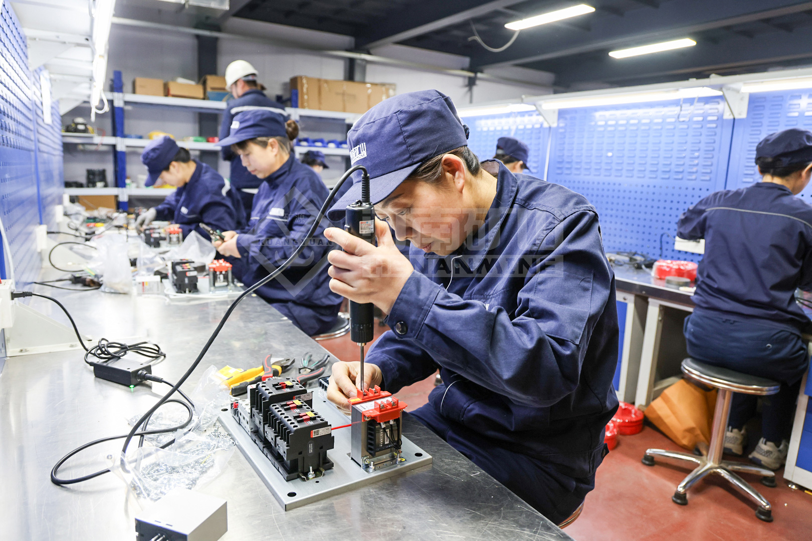 Electrical assembly participants completing wiring tasks