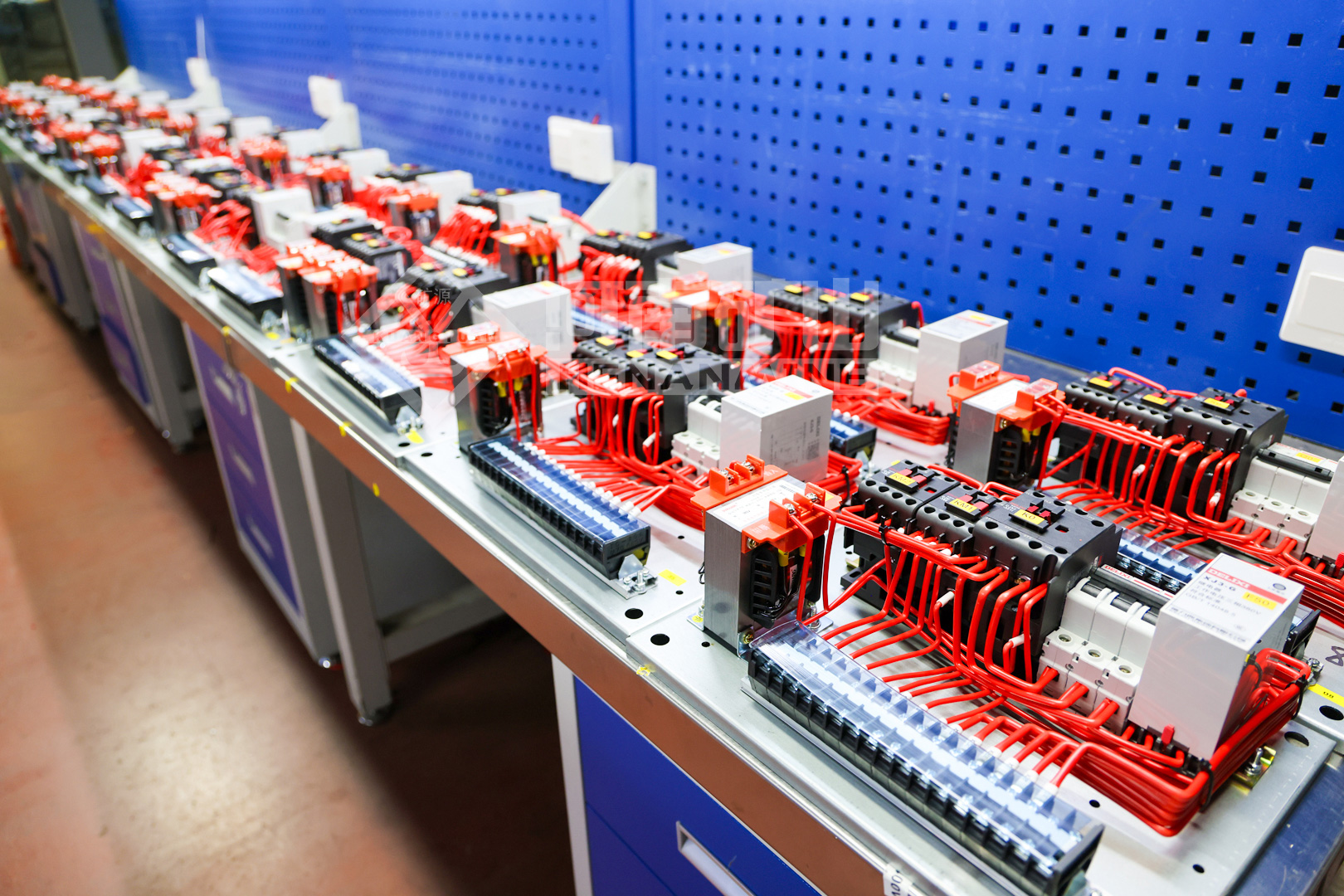 Electrical assembly components laid out on a workshop bench