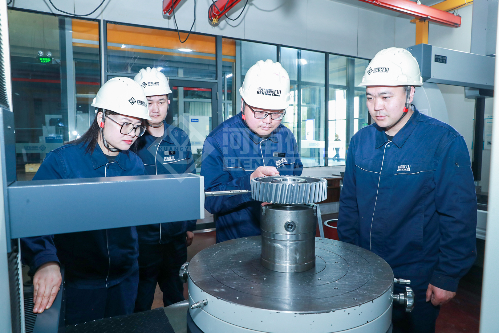 Inspection team examining a machined component