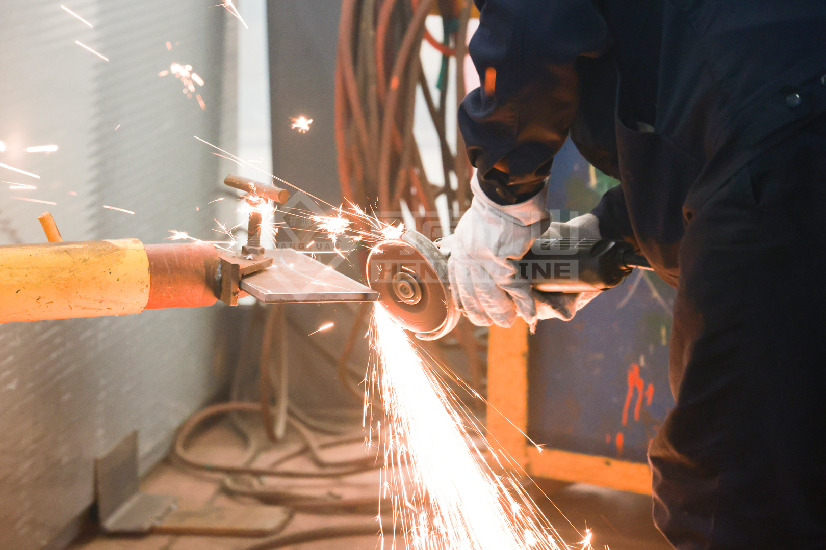 Employee finishing a metal component during the skills event
