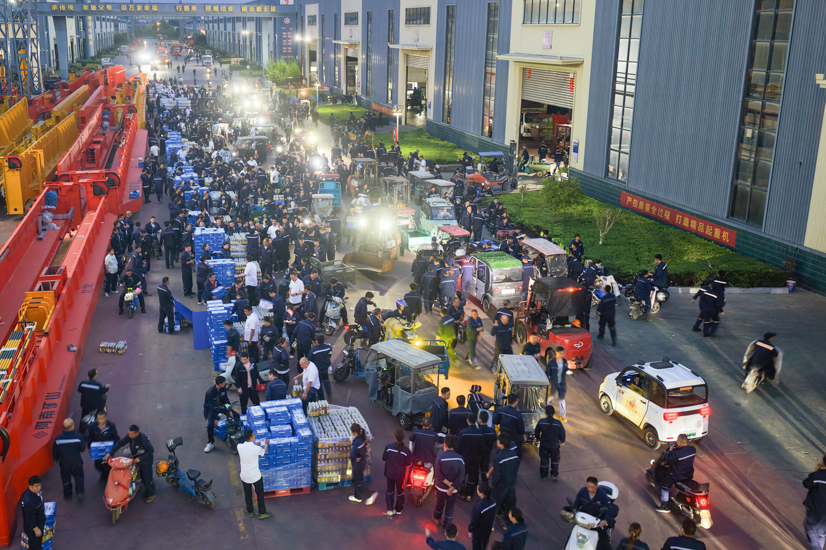 Employees gathered outside the manufacturing workshops after the meeting