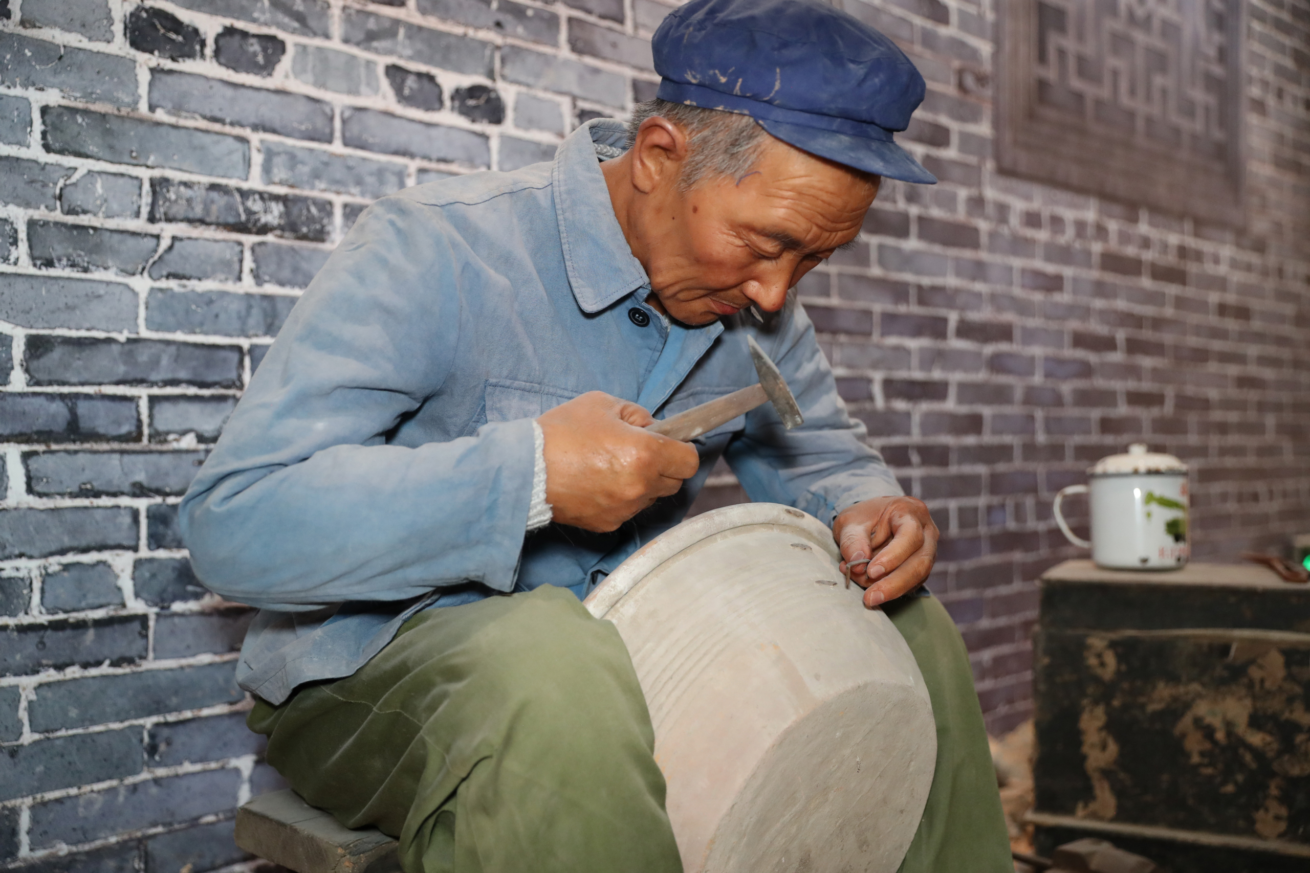 Reconstructed scene of a worker making traditional equipment