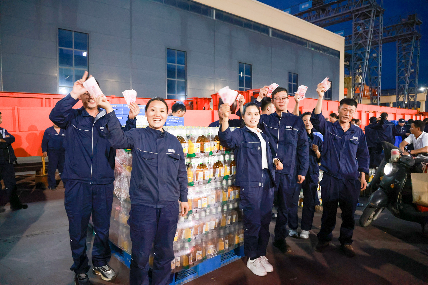 Employees with seasonal benefit packages outside a workshop