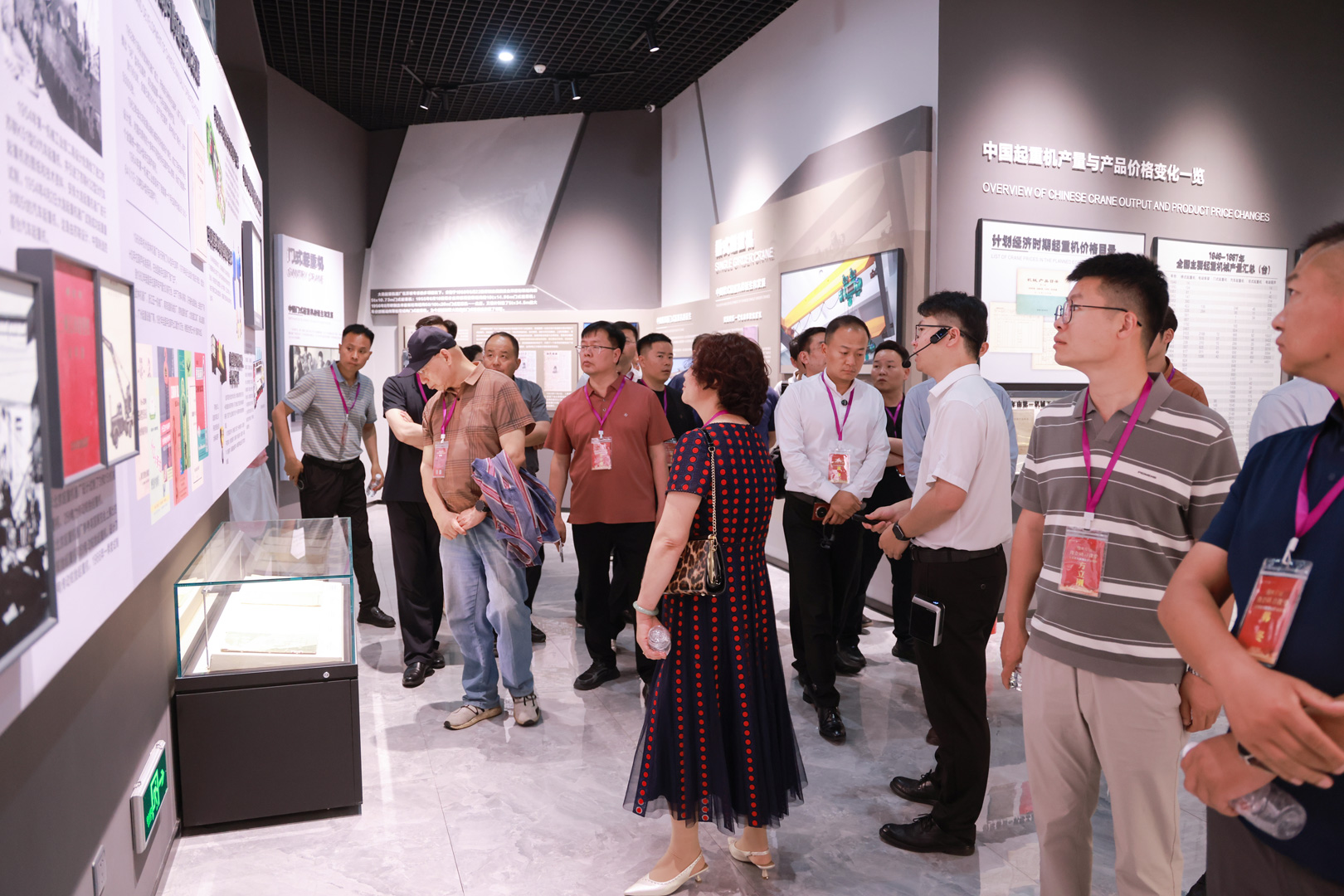Visitors studying crane history displays in the museum