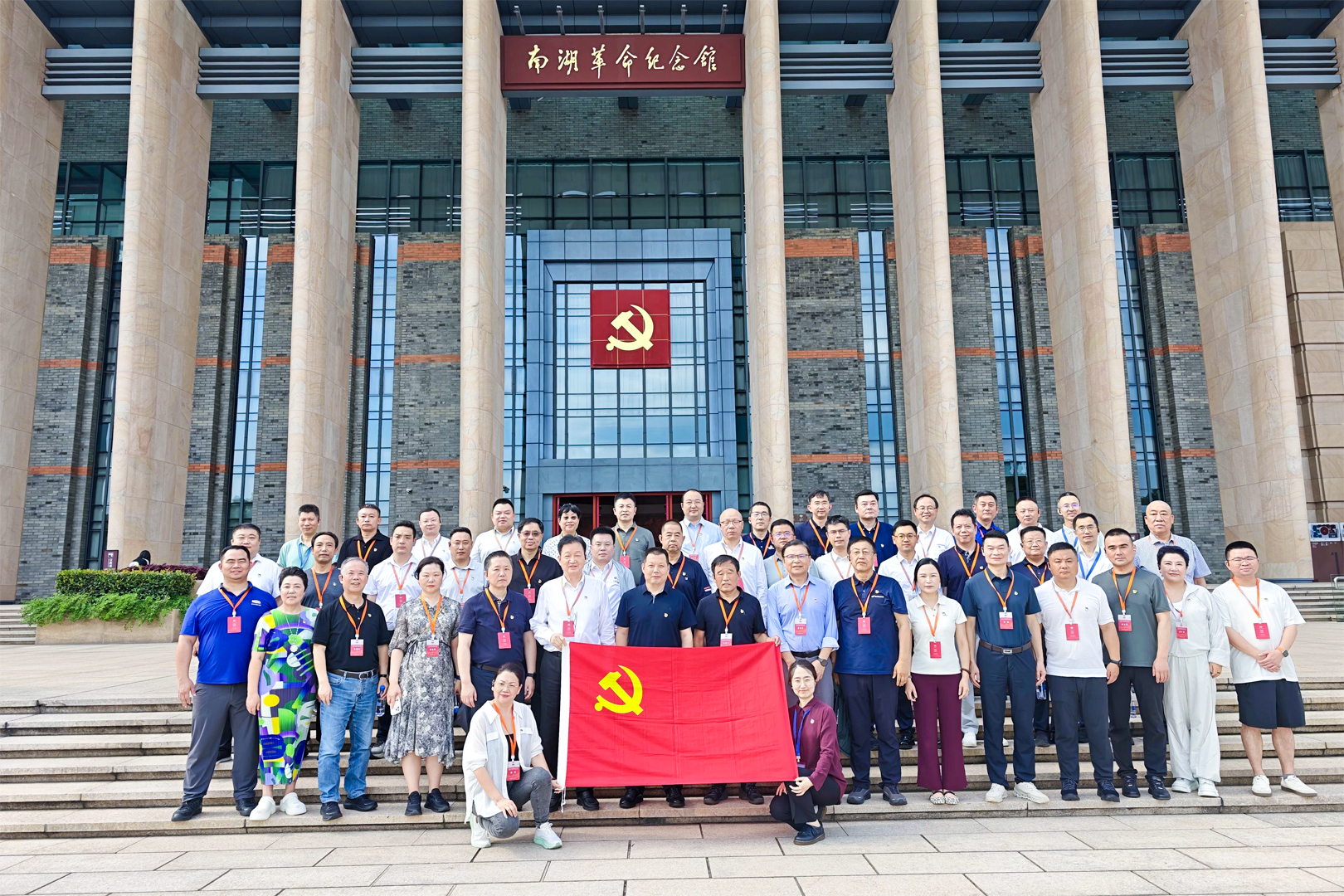 Seminar participants outside the training venue