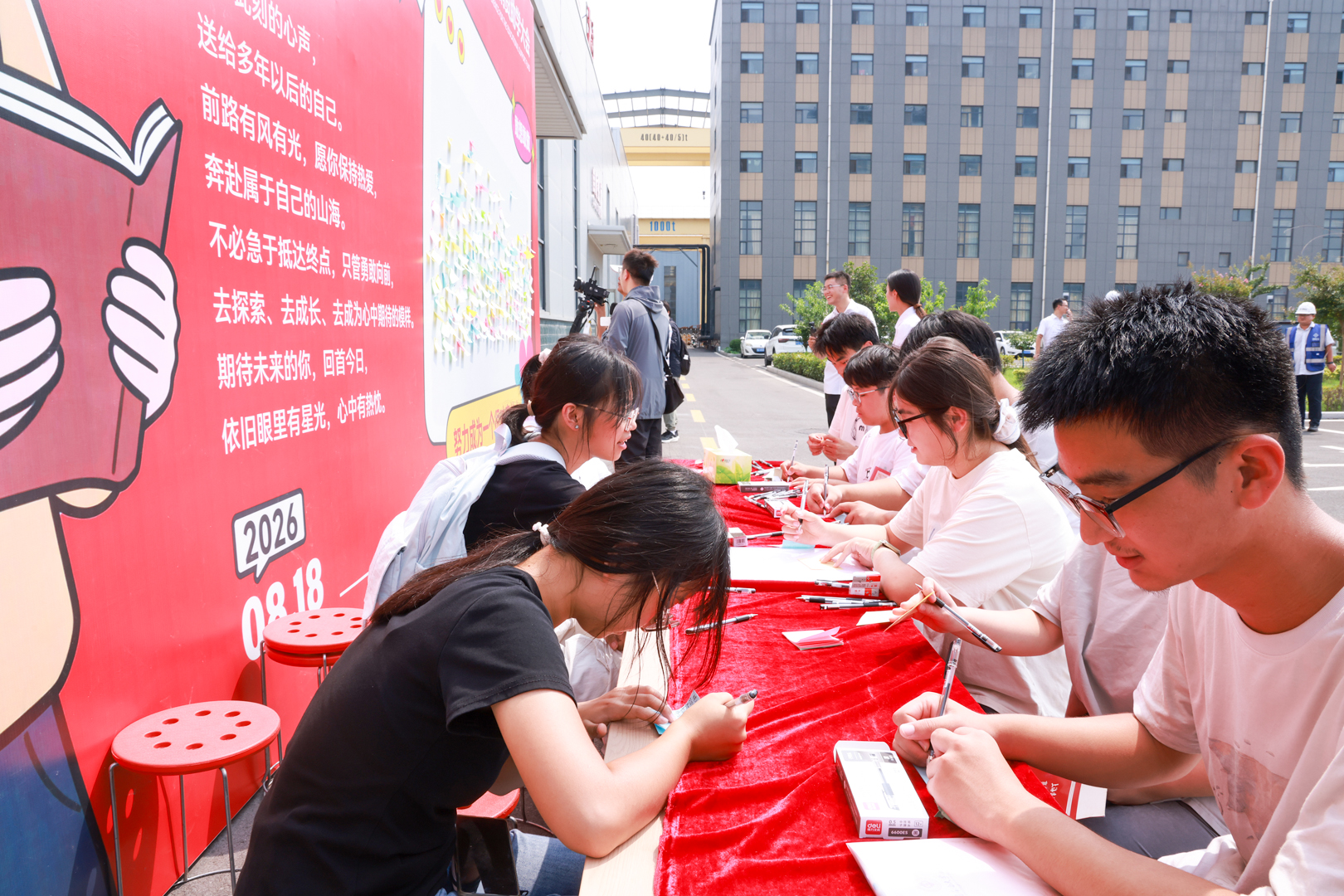 Students signing at the grant collection table