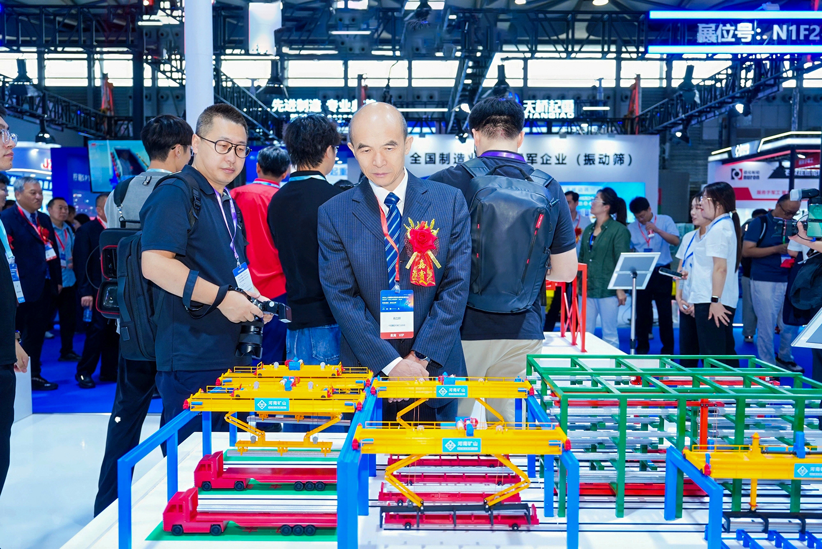Visitors viewing model lifting equipment at the exhibition Visitors viewing model lifting equipment at the exhibition