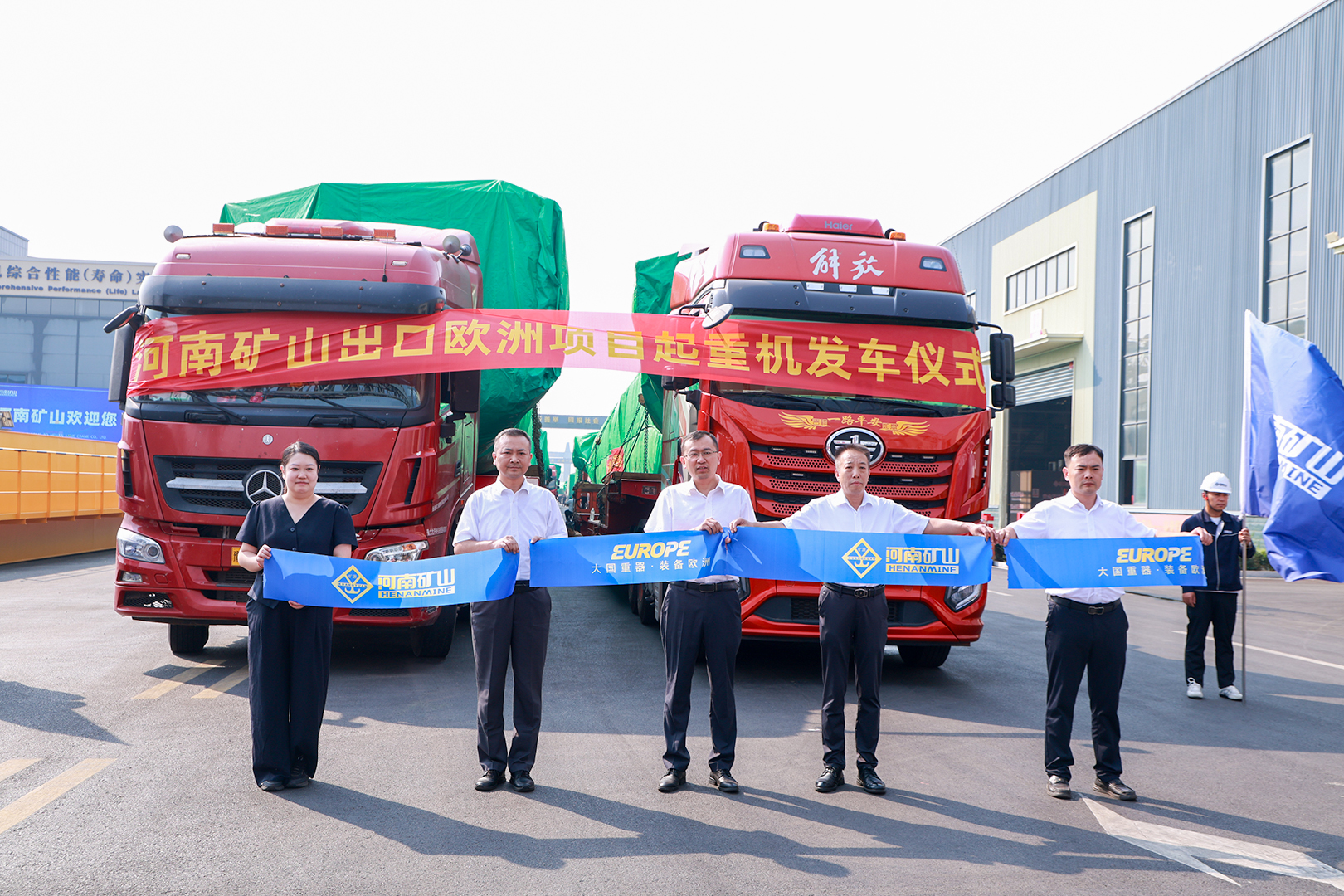 Representatives alongside trucks prepared for the European crane shipment Representatives alongside trucks prepared for the European crane shipment