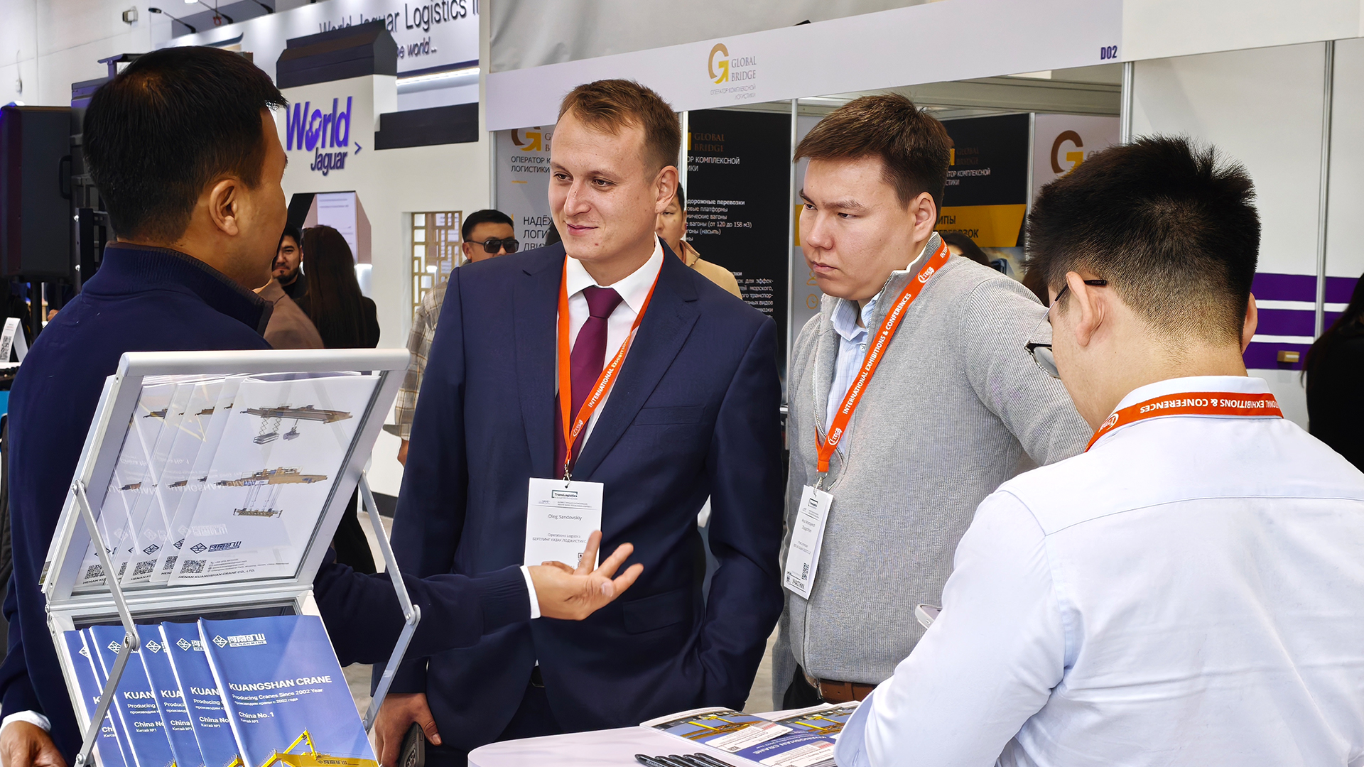 Visitors reviewing technical information with the Henan Mine Crane exhibition team Visitors reviewing technical information with the Henan Mine Crane exhibition team