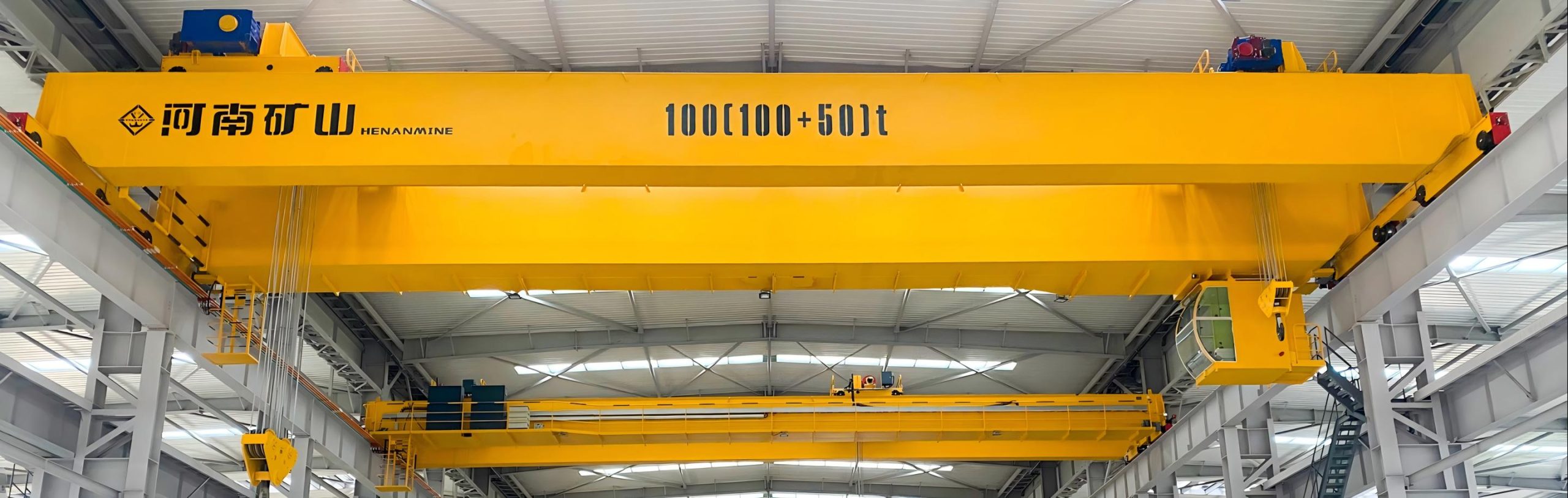 double-girder crane serving a tall heavy fabrication workshop
