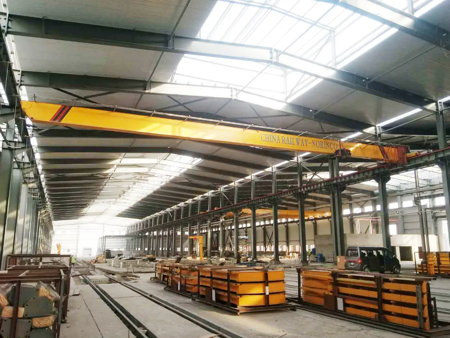 overhead crane above a railway maintenance workshop