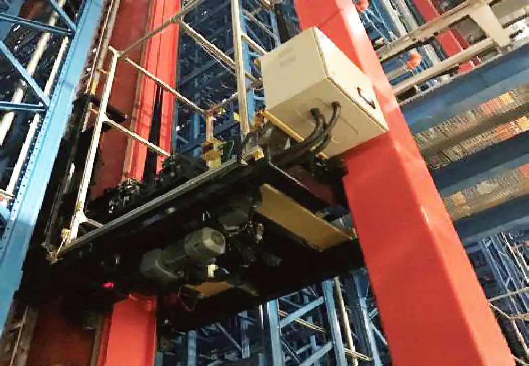 Automated warehouse stacker crane fork and load transfer interface