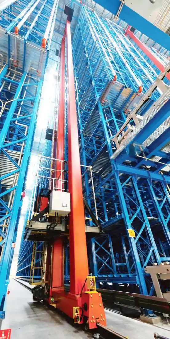 Automated warehouse stacker crane fork and load transfer interface